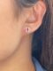 Aretes pequeños de rubí con halo de diamantes